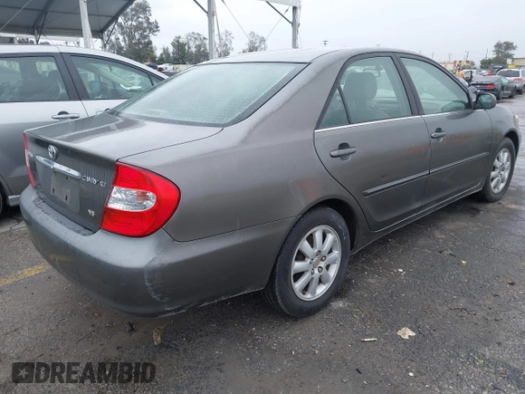 2004 Toyota Camry LE with VIN JTDBF32K740152841, listed as a IAAI auction lot 41808909 with 142,611 mi miles. Bid and sale history available at carsss.com. Image 4.