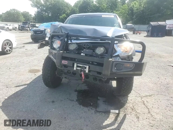 2014 Toyota Tacoma with VIN 3TMLU4EN2EM163797, listed as a Copart auction lot 61078805 with 130,748 mi miles and Salvage title. Bid and sale history available at DreamBid. Image 14.