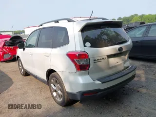2015 Subaru Forester Touring with VIN JF2SJAWC9FH573973, listed as a IAAI auction lot 42380080 with 87,938 mi miles and . Bid and sale history available at DreamBid. Image 3.