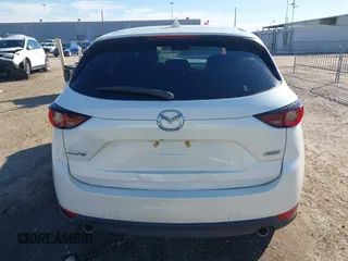 2019 Mazda CX-5 Touring with VIN JM3KFACM4K1668352, listed as a IAAI auction lot 41481291 with 65,901 mi miles and . Bid and sale history available at carsss.com. Image 16.
