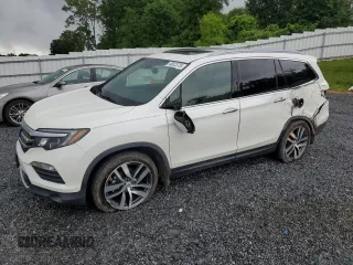 2017 Honda Pilot Touring with VIN 5FNYF5H91HB032616, listed as a Copart auction lot 56823735 with 79,654 mi miles and Salvage title. Bid and sale history available at DreamBid. Image 1.
