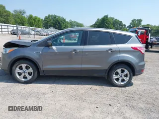 2014 Ford Escape SE with VIN 1FMCU9GXXEUE08655, listed as a IAAI auction lot 42469634 with 163,054 mi miles and . Bid and sale history available at DreamBid. Image 14.