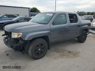 2012 Honda Ridgeline RTS with VIN 5FPYK1F46CB460256, listed as a Copart auction lot 70879644 with 136,217 mi miles and Salvage Title. Bid and sale history available at carsss.com. Image 1.