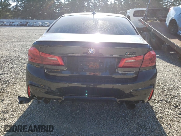 2018 BMW M5 z VIN WBSJF0C57JB283361, wystawiony jako Copart lot #65352164 z przebiegiem Nie podano mil oraz Szkoda całkowita • Salvage title. Historia ofert i sprzedaży dostępna na DreamBid. Obrazek 6.