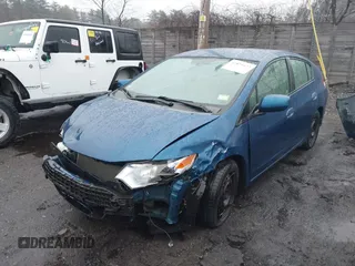 2012 Honda Insight with VIN JHMZE2H31CS005377, listed as a IAAI auction lot 41879122 with 136,646 mi miles and . Bid and sale history available at DreamBid. Image 2.