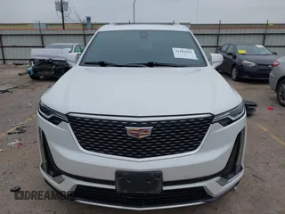 2021 Cadillac XT6 Premium Luxury z VIN 1GYKPCRSXMZ169206, wystawiony jako IAAI lot #41581841 z przebiegiem 64 789 mil mil oraz . Historia ofert i sprzedaży dostępna na DreamBid. Obrazek 6.