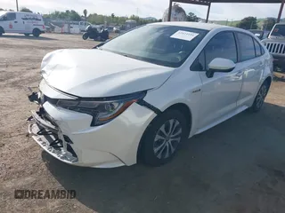 2020 Toyota Corolla Hybrid LE with VIN JTDEBRBE4LJ019579, listed as a IAAI auction lot 42024106 with 59,240 mi miles. Bid and sale history available at carsss.com. Image 2.