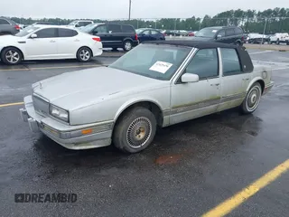 1991 Cadillac Seville z VIN 1G6KS53B2MU813855, wystawiony jako IAAI lot #42425470 z przebiegiem 168 194 mil mil oraz . Historia ofert i sprzedaży dostępna na DreamBid. Obrazek 2.