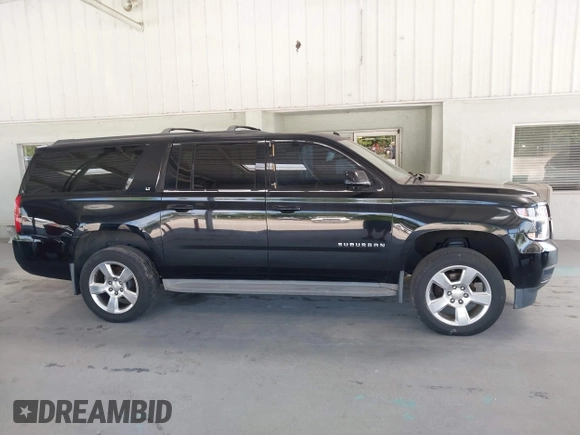 2015 Chevrolet Suburban LT with VIN 1GNSKJKC7FR199544, listed as a IAAI auction lot 42169017 with 219,219 mi miles and . Bid and sale history available at DreamBid. Image 13.