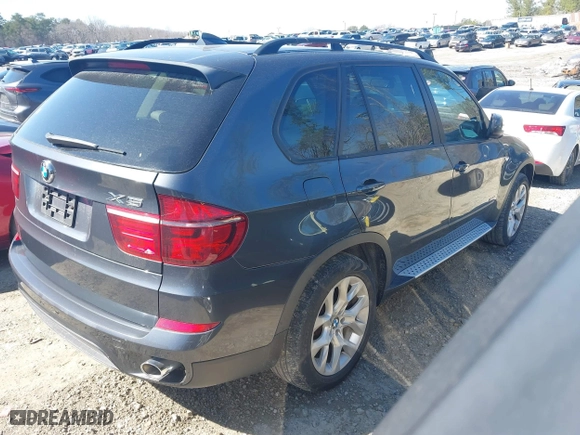 2011 BMW X5 35i with VIN 5UXZV4C51BL740731, listed as a IAAI auction lot 41771257 with 148,638 mi miles. Bid and sale history available at carsss.com. Image 4.