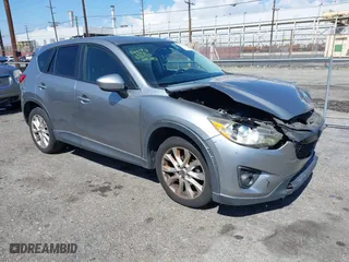2014 Mazda CX-5 Grand Touring with VIN JM3KE2DY0E0331942, listed as a IAAI auction lot 41750533 with 163,387 mi miles. Bid and sale history available at carsss.com. Image 1.