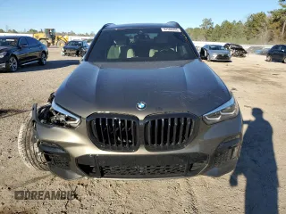 2022 BMW X5 sDrive40i with VIN 5UXCR4C02N9J39621, listed as a Copart auction lot 87696995 with 0 mi miles and Salvage Title. Bid and sale history available at carsss.com. Image 5.
