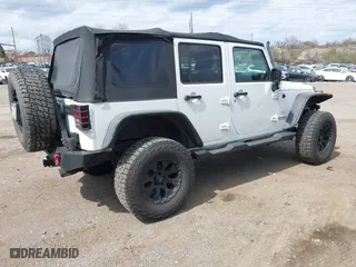 2012 Jeep Wrangler Unlimited Sahara with VIN 1C4BJWEG9CL220965, listed as a IAAI auction lot 41902295 with 120,492 mi miles. Bid and sale history available at carsss.com. Image 4.