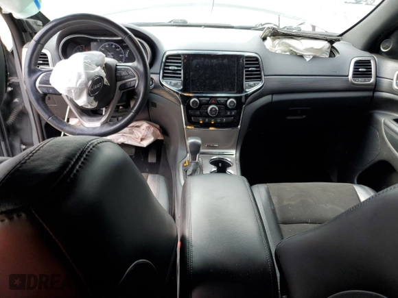 2020 Jeep Grand Cherokee Laredo E with VIN 1C4RJEAG0LC404979, listed as a Copart auction lot 81999474 with 57,328 mi miles and Salvage title. Bid and sale history available at DreamBid. Image 8.
