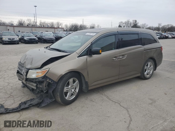 2012 Honda Odyssey Touring with VIN 5FNRL5H9XCB078399, listed as a Copart auction lot 52360165 with 174,819 mi miles and Salvage Title. Bid and sale history available at DreamBid. Image 1.