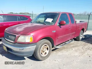 2000 Ford F-150 XL with VIN 1FTZX1725YNA94343, listed as a IAAI auction lot 41659358 with 295,337 mi miles. Bid and sale history available at carsss.com. Image 2.
