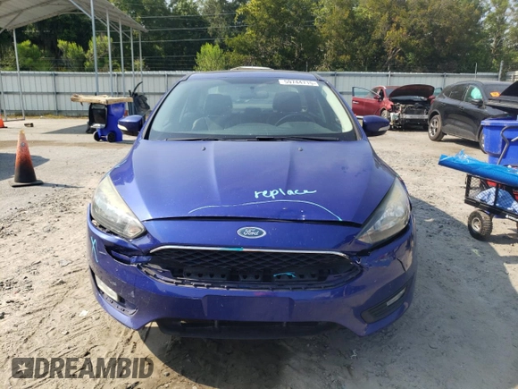 2015 Ford Focus SE with VIN 1FADP3F2XFL299193, listed as a Copart auction lot 59744715 with 141,317 mi miles and Salvage title. Bid and sale history available at DreamBid. Image 5.
