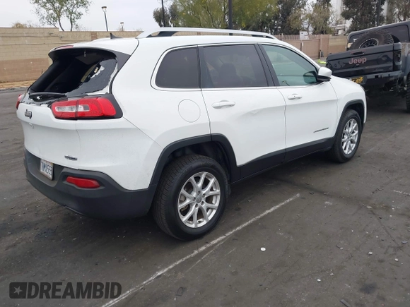 2015 Jeep Cherokee Latitude with VIN 1C4PJLCB0FW761871, listed as a IAAI auction lot 42099336 with 213,049 mi miles and . Bid and sale history available at DreamBid. Image 4.