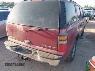 2004 Chevrolet Tahoe LS z VIN 1GNEC13VX4J112970, wystawiony jako IAAI lot #42380764 z przebiegiem 294 201 mil mil oraz . Historia ofert i sprzedaży dostępna na DreamBid. Obrazek 4.