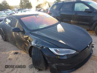 2021 Tesla Model S Plaid with VIN 5YJSA1E62MF451785, listed as a IAAI auction lot 40520806 with 31,084 mi miles. Bid and sale history available at carsss.com. Image 1.