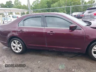 2012 Ford Fusion SE z VIN 3FAHP0HA4CR429812, wystawiony jako IAAI lot #42217492 z przebiegiem 207 215 mil mil oraz . Historia ofert i sprzedaży dostępna na DreamBid. Obrazek 13.