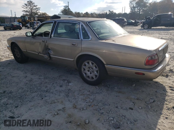 1998 Jaguar XJ with VIN SAJHX1242WC845736, listed as a Copart auction lot 82006044 with 188,785 mi miles and Salvage title. Bid and sale history available at DreamBid. Image 2.