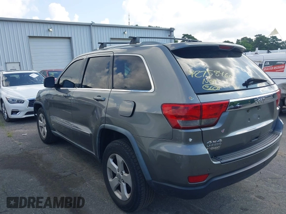 2011 Jeep Grand Cherokee Laredo with VIN 1J4RR4GG7BC736694, listed as a IAAI auction lot 42758461 with 159,875 mi miles and . Bid and sale history available at DreamBid. Image 3.