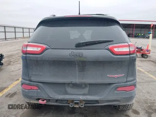 2015 Jeep Cherokee Trailhawk with VIN 1C4PJMBS0FW668730, listed as a IAAI auction lot 41462037 with 83,454 mi miles. Bid and sale history available at carsss.com. Image 16.
