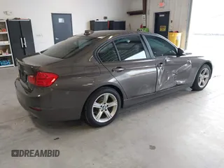 2015 BMW 3 Series 328i with VIN WBA3A5C57FF609734, listed as a IAAI auction lot 41392336 with 121,378 mi miles. Bid and sale history available at carsss.com. Image 4.