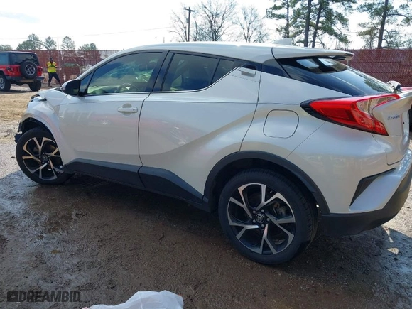 2019 Toyota C-HR XLE with VIN JTNKHMBX2K1041838, listed as a IAAI auction lot 41511513 with 107,145 mi miles. Bid and sale history available at carsss.com. Image 3.