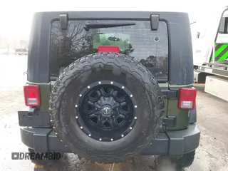 2009 Jeep Wrangler Rubicon z VIN 1J8GA64169L743008, wystawiony jako IAAI lot #41792451 z przebiegiem 142 414 mil mil oraz . Historia ofert i sprzedaży dostępna na DreamBid. Obrazek 16.