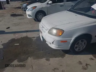 2004 Hyundai Accent with VIN KMHCF35C94U315390, listed as a IAAI auction lot 41391877 with 162,406 mi miles. Bid and sale history available at carsss.com. Image 6.