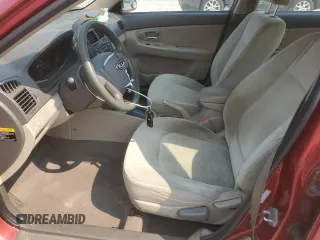 2009 Kia Spectra EX with VIN KNAFE222X95639845, listed as a Copart auction lot 71028794 with 111,377 mi miles and Salvage Title. Bid and sale history available at carsss.com. Image 7.