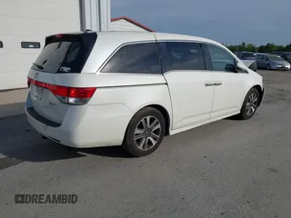 2014 Honda Odyssey Touring with VIN 5FNRL5H94EB001479, listed as a IAAI auction lot 41123678 with 147,269 mi miles and . Bid and sale history available at carsss.com. Image 4.