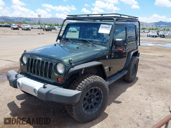 2012 Jeep Wrangler Sahara z VIN 1C4AJWBGXCL100527, wystawiony jako IAAI lot #42394623 z przebiegiem 126 097 mil mil oraz . Historia ofert i sprzedaży dostępna na DreamBid. Obrazek 2.