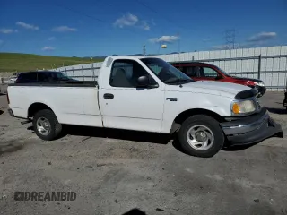 2001 Ford F-150 XL z VIN 3FTZF17211MA71306, wystawiony jako Copart lot #57824475 z przebiegiem 186 866 mil mil oraz Szkoda całkowita • Salvage title. Historia ofert i sprzedaży dostępna na DreamBid. Obrazek 4.