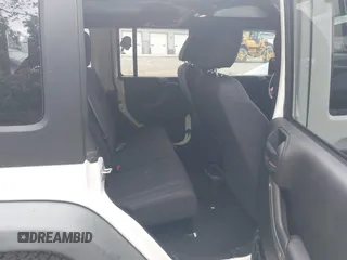 2014 Jeep Wrangler Unlimited Sport with VIN 1C4BJWDG9EL135077, listed as a IAAI auction lot 42324775 with 104,221 mi miles and . Bid and sale history available at DreamBid. Image 8.