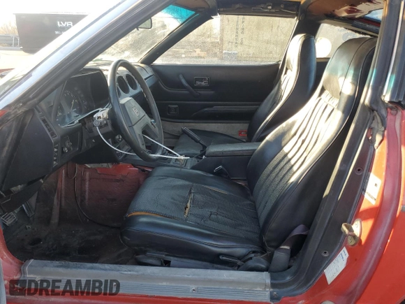 1983 Datsun 280ZX z VIN JN1HZ04S0DX569855, wystawiony jako Copart lot #74027594 z przebiegiem 12 300 mil mil oraz Szkody całkowita. Historia ofert i sprzedaży dostępna na DreamBid. Obrazek 7.