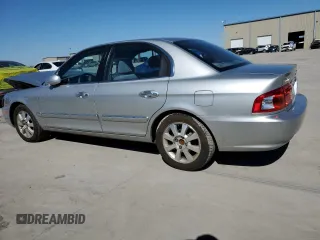 2005 Kia Optima LX z VIN KNAGD128055433689, wystawiony jako Copart lot #46909305 z przebiegiem 27 609 mil mil oraz Szkoda całkowita • Salvage title. Historia ofert i sprzedaży dostępna na DreamBid. Obrazek 2.