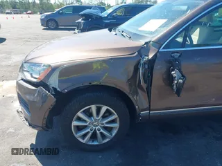 2014 Volkswagen Touareg Sport with VIN WVGEF9BP7ED003525, listed as a IAAI auction lot 41868307 with 74,379 mi miles and . Bid and sale history available at DreamBid. Image 6.