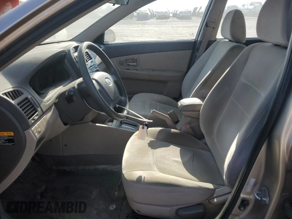2009 Kia Spectra LX z VIN KNAFE222995618257, wystawiony jako Copart lot #56179025 z przebiegiem 270 087 mil mil oraz Szkoda całkowita • Salvage title. Historia ofert i sprzedaży dostępna na DreamBid. Obrazek 7.
