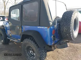 1995 Jeep Wrangler S with VIN 1J4FY19P3SP260597, listed as a IAAI auction lot 41883021 with 176,555 mi miles. Bid and sale history available at carsss.com. Image 3.