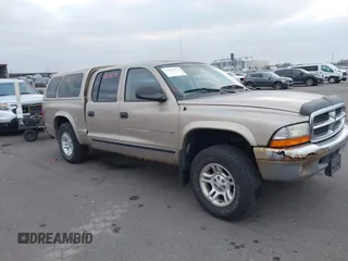 2002 Dodge Dakota SLT with VIN 1B7HG48N32S663205, listed as a IAAI auction lot 41125874 with 186,761 mi miles. Bid and sale history available at carsss.com. Image 1.