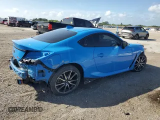 2023 Toyota GR86 with VIN JF1ZNBC11P8758861, listed as a Copart auction lot 77705634 with 11,684 mi miles and Salvage Title. Bid and sale history available at carsss.com. Image 3.