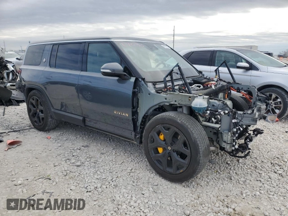2022 Rivian R1S Launch Edition with VIN 7PDSGABL3NN000739, listed as a Copart auction lot 88127995 with 12,143 mi miles and Salvage Title. Bid and sale history available at DreamBid. Image 4.