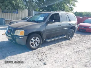 2004 GMC Envoy SLE with VIN 1GKDS13S342117178, listed as a IAAI auction lot 42164611 with 181,287 mi miles and . Bid and sale history available at DreamBid. Image 2.