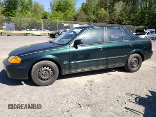 1999 Mazda Protege DX with VIN JM1BJ2223X0139775, listed as a Copart auction lot 54338455 with 63,198 mi miles and Salvage Title. Bid and sale history available at DreamBid. Image 1.