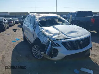 2022 Cadillac XT4 FWD Luxury with VIN 1GYAZAR48NF170949, listed as a IAAI auction lot 41857671 with 25,881 mi miles and . Bid and sale history available at carsss.com. Image 1.
