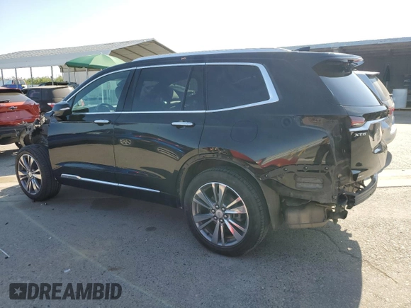 2021 Cadillac XT6 Premium Luxury with VIN 1GYKPDRS4MZ175962, listed as a Copart auction lot 59993565 with 97,157 mi miles and Salvage title. Bid and sale history available at DreamBid. Image 2.