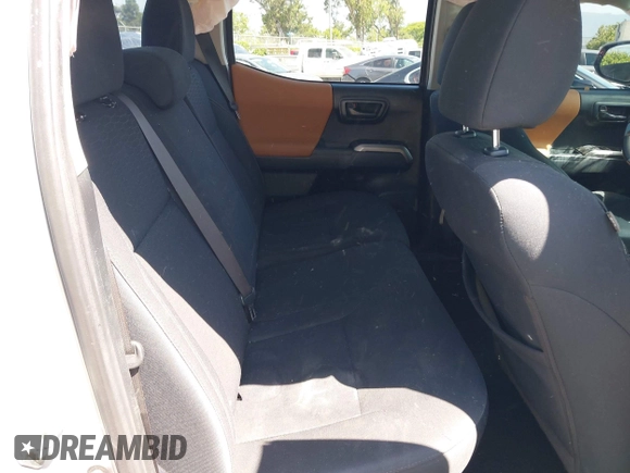 2018 Toyota Tacoma SR with VIN 5TFAX5GN2JX103685, listed as a IAAI auction lot 42392032 with 138,678 mi miles and . Bid and sale history available at DreamBid. Image 8.